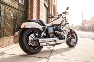Motorcycle parked street building wooden - the side of a street next free wallpaper