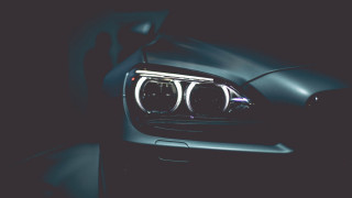 Black car black background repeated - a black car free wallpaper