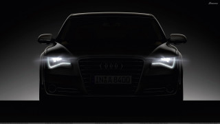 Black car headlights dark room 2 - a black car free wallpaper