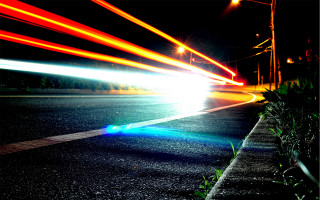 Street car lights streaking night - long exposure free wallpaper