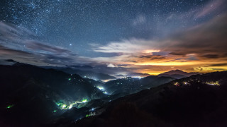 Night sky stars clouds mountain 2 - over a mountain range free wallpaper