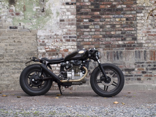Motorcycle parked brick wall black - a brick wall free wallpaper