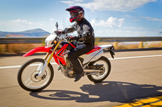 Man riding red motorcycle yellow - the road free wallpaper