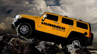 Yellow hummer rocky beach cloudy - cloudy free wallpaper