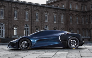 Futuristic car parked large building 2 - a clock tower free wallpaper