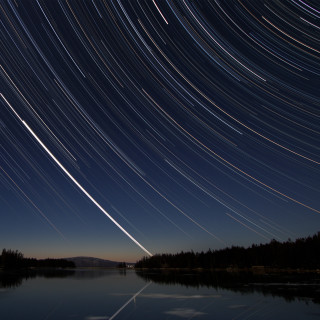 Lake stars sky trees lights - free airplane wallpaper