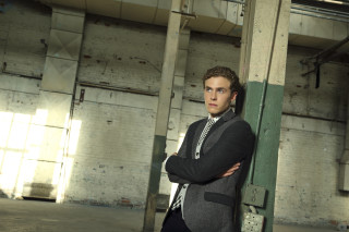 Warehouse man suit leaning crossed - christopher wood free wallpaper
