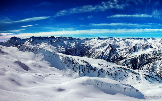 Mountain range plane view blue - a few snow covered mountains free wallpaper