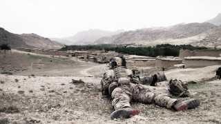 Soldier laying ground legs crossed 2 - a soldier free wallpaper