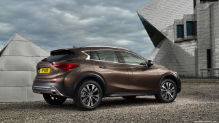 Brown car parked building large - side profile free wallpaper