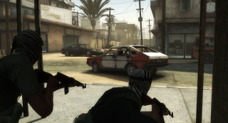 Man holding gun car street - a palm tree in the background free wallpaper
