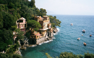 Cliffside house water boats scenery - the water below free wallpaper