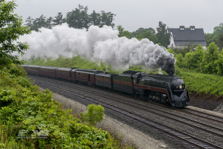Train traveling smoke stacks tracks - a train free wallpaper