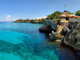 Beach thatched roof blue lagoon - roof free wallpaper