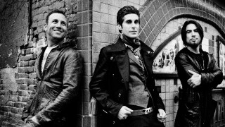 Men group brick wall doorway - a group of men free wallpaper