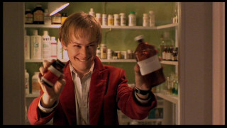 Man holding bottle pharmacy shelves - doc hammer free wallpaper