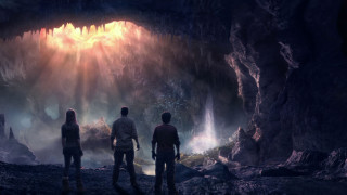 Three people cave light entrance - a cave free wallpaper