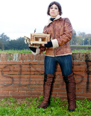 Woman brown jacket holding box - steampunk free wallpaper