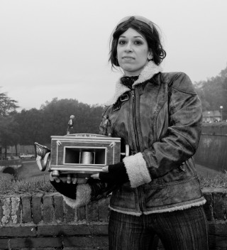 Woman holding small box clock - new free wallpaper