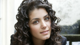 Woman curly hair black jacket 2 - a black jacket free wallpaper
