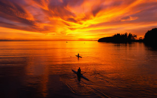 Person riding surfboard water sunset - a person riding free wallpaper