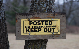 No trespassing sign tree area - possible free wallpaper