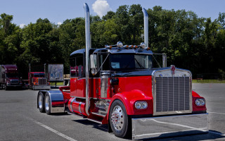 Red semi truck parking lot 6 - a red semi truck free wallpaper