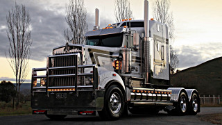 Semi truck parked road forest - a large semi truck free wallpaper