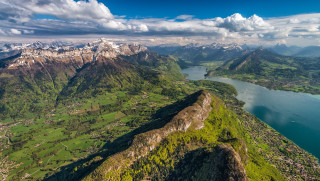 Mountain lake background clouds sky - a view of a mountain range free wallpaper