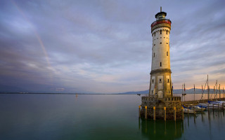 Lighthouse pier water boats precisionism - the water below free wallpaper