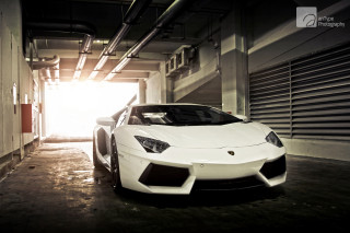 White sports car parking garage 13 - a parking garage free wallpaper