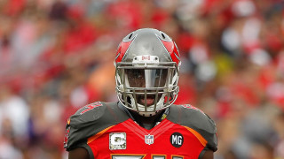 Football player helmet red jersey - a crowd in the background free wallpaper