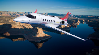 Small white plane mountain lake - feature free wallpaper
