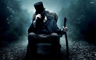 Man top hat coat sitting - a cane free wallpaper