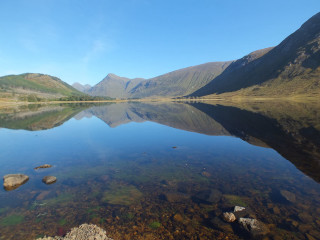 Lake mountains rocks clear blue - widescreen free wallpaper