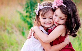 Little girls hugging field grass - caroline lucy scott free wallpaper