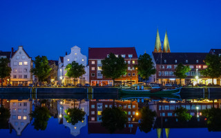 City river boat night church - a church in the background free wallpaper