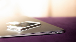 Cell phone laptop purple surface - a white light free wallpaper