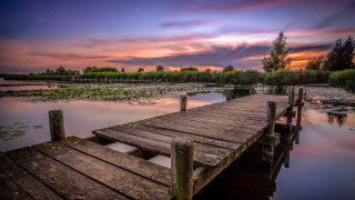 Wooden dock lake cloudy sky - top of a lake under a cloudy sky free wallpaper