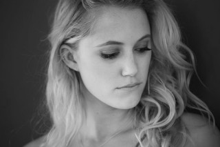 Woman blonde hair serious look - portrait photography free wallpaper
