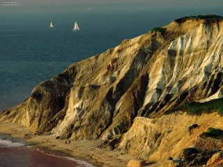 Rocky cliff sailboat distance water - a matte painting free wallpaper