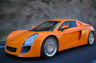 Bright orange sports car cliff 2 - orange sports car free wallpaper