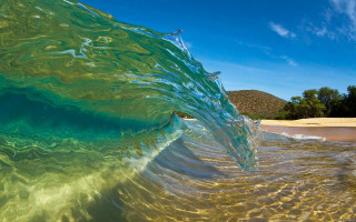 Wave beach sky ocean water - a clear blue sky in the background free wallpaper