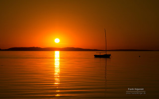 Boat sunset water peaceful scenery - the distance behind free wallpaper