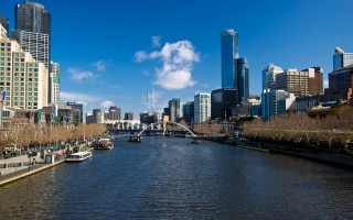 River boats tall buildings city - a river free wallpaper for desktop