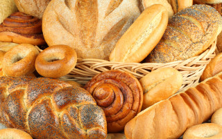 Basket filled breads rolls table - a basket free wallpaper