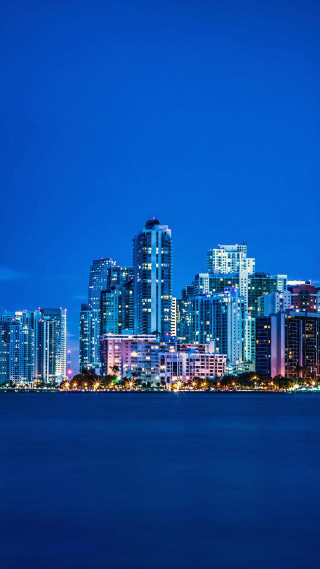 City skyline night water boat 4 - free city wallpaper