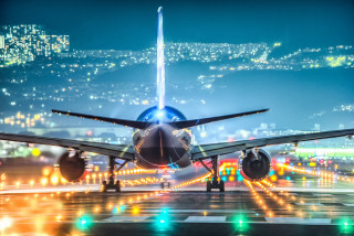 Jetliner airport tarmac night lights 3 - top of an airport tarmac free wallpaper