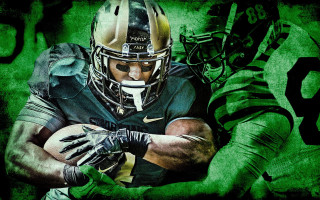 Football player holding football green - helmet free wallpaper