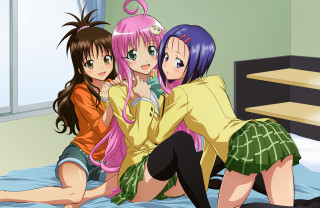 Three girls hugging on bed - a green skirt free wallpaper